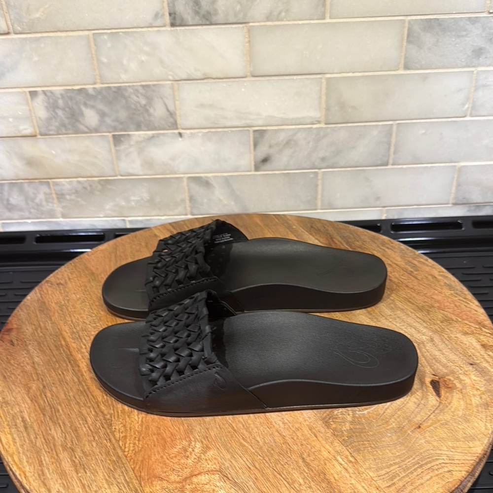 OluKai Kamola Black Leather Woven Slide Sandals